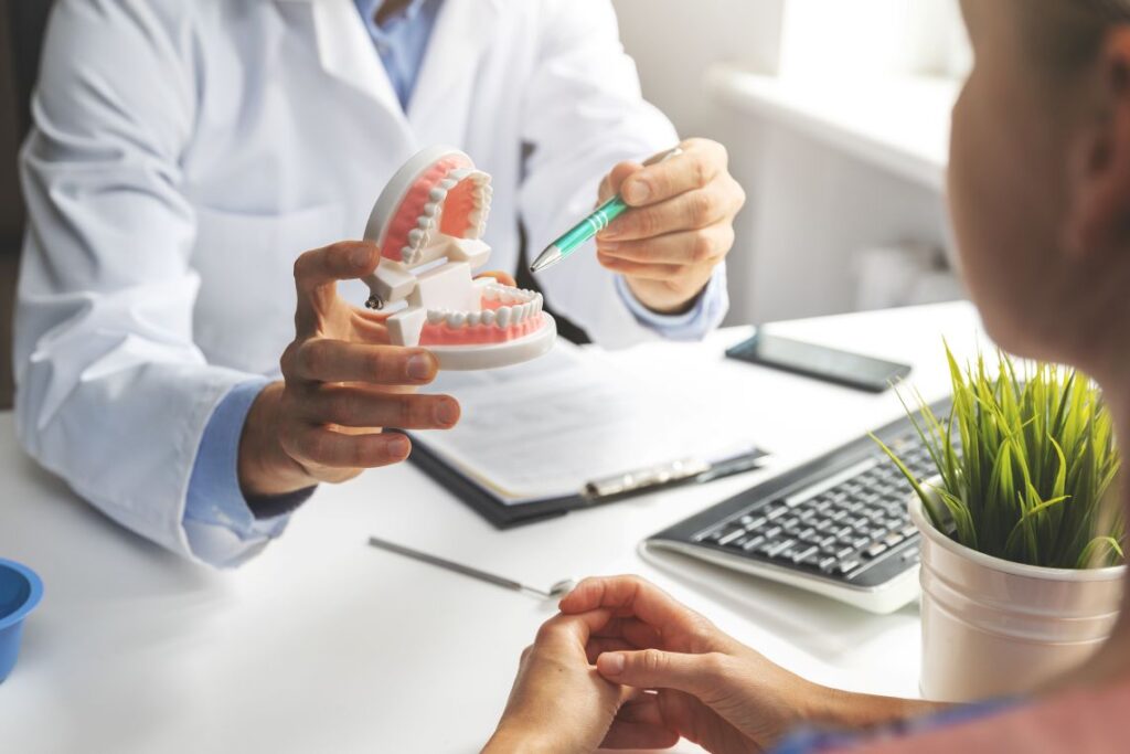 A person at a dental implant consultation with their dentist