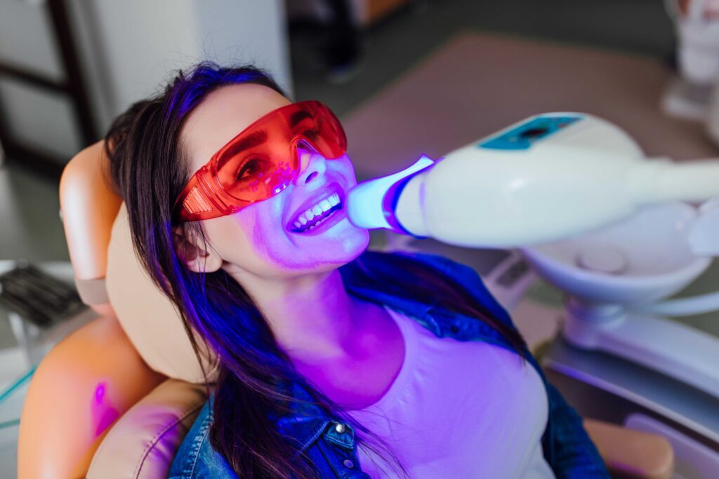 Woman getting teeth whitening