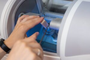 Dentist placing porcelain block in CEREC machine